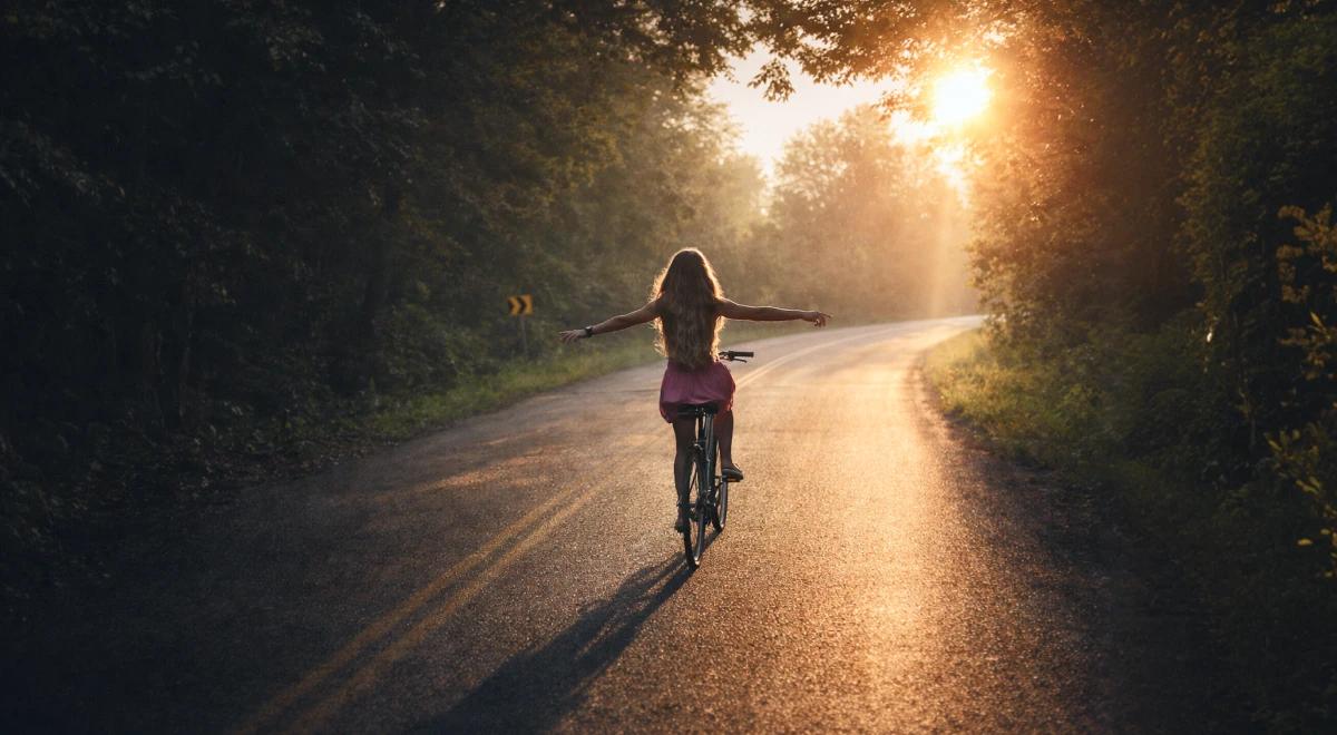 A girl riding on a bike on the empty road