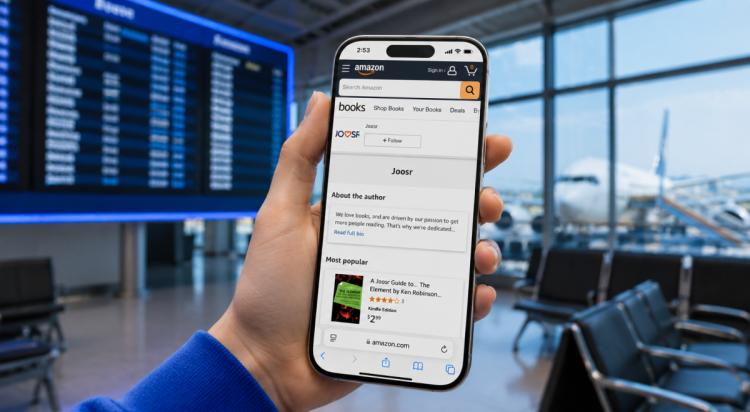 Hand holding a smartphone displaying the Joosr author page on Amazon books in an airport terminal with a departure board and airplane visible through the windows