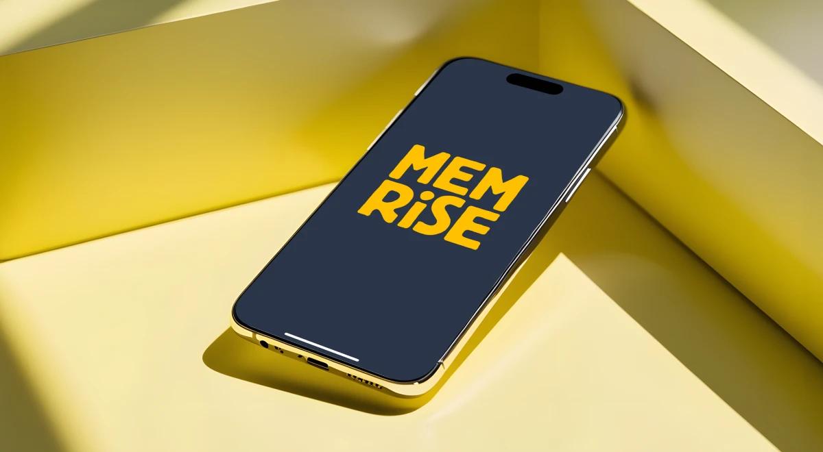 Smartphone displaying the Memrise app logo on a black screen, placed flat on a yellow surface with geometric shadows, representing this language app review