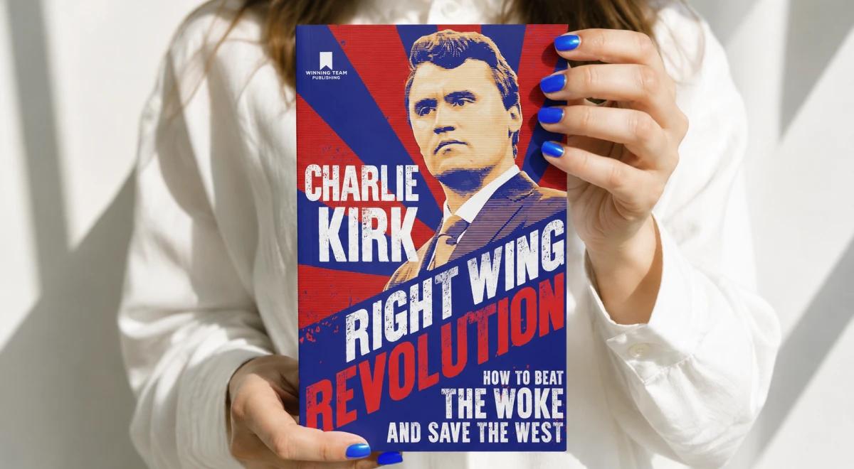 Woman in a white shirt with blue nails holding Charlie Kirk's book _Right Wing Revolution_ against a light background