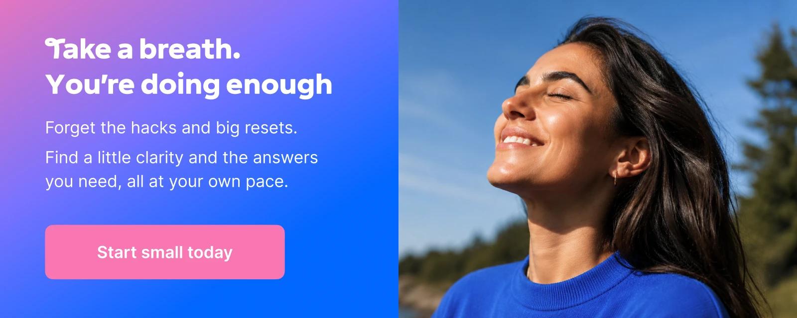 Happy woman in a blue sweater smiling with closed eyes and face lifted toward the sky, standing near a peaceful lake surrounded by green trees, promoting the Headway microlearning app