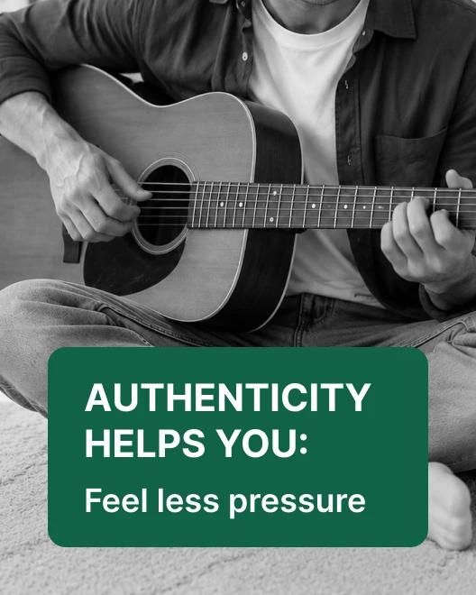 Person sitting cross-legged playing acoustic guitar in black and white, illustrating authenticity and communication skills for how to talk to anyone