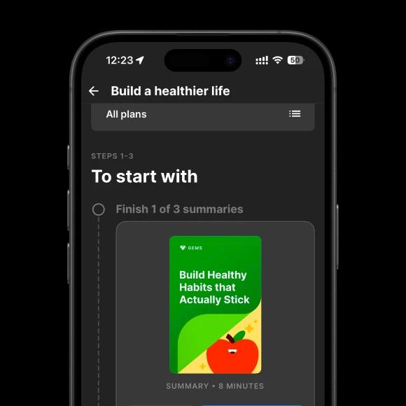A phone mockup with build healthy habits that actually stick book summary collection